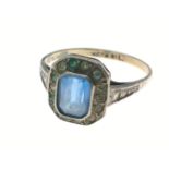 A 9ct & silver set ring with blue central stone with clear stones surround, size L, gross weight