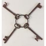 SIMPLY MARVELLOUS! A SET of FOUR decorative large rusty old keys all on a solid ring - each key
