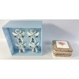 A set of four LIFESTYLE WITH WEDGWOOD silver coloured angel napkin rings, and WEDGWOOD Clio