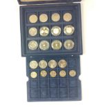 A Westminster 2 tier coin display case with 16 five pound coins, and 5 £2 coins