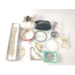 A collection of 13 costume jewellery bracelets made of materials including diamante, shell, bone,