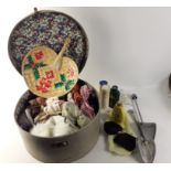 A vintage hat travel box containing ladies accessories such as toiletries shoe horn, purses,