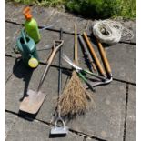 A collection of useful garden tools to include a watering can and green sprayer etc