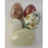 A small collection of decorative eggs to include a hand-made ST PETERSBURG, Russia red glass with