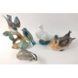 A decorative collection of ceramic ornaments to include a duck approx