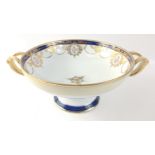 An attractive porcelain bowl (23cm dia), with heavy gilt decoration on a pedestal standing 11cm