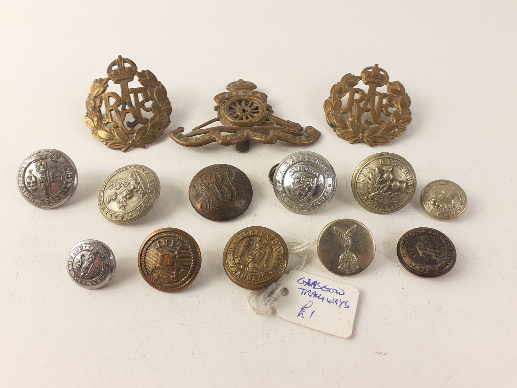 An interesting collection of three military badges and some very unusual and collectible uniform