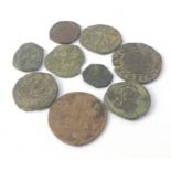 A collection of unidentified smaller coins with lots of detail to facilitate further research