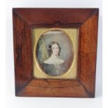 An early 19th century portrait miniature of a woman in a rosewood frame frame dimensions 17.5cmH x