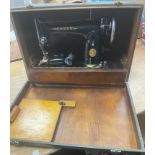 A VINTAGE SINGER electric sewing machine in original case with serial No EE912060 (Dec 1948) -