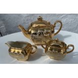 A vintage SADLER gilt tea service comprising teapot, milk jug and sugar bowl,