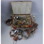 A Sea Shell Jewellery box with lots of interesting costume jewellery inside.