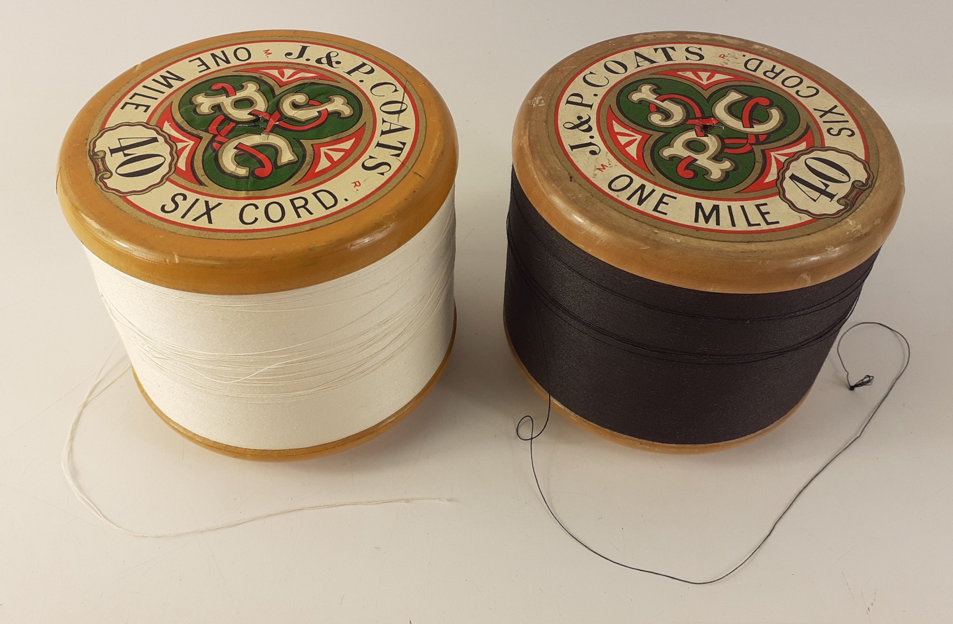Rare to find - two J&P Coats one mile bobbins with white and black 6 cord thread