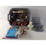 A box of bric-a-brac to include Christmas decorations, cookie cutters, small dolls in national
