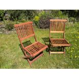 A pair of Indonesian hardwood folding garden chairs - in nice condition - handy for those lazy