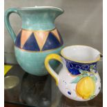 Two beautiful hand-painted and elegantly shaped jugs