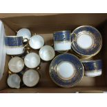 A lovely wee coffee set in a rich blue with gilt highlights, comprising 10 coffee cans, 12