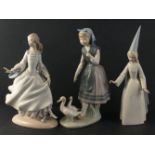 A collection of LLADRO figurines with slight damage