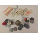 A small mixed collection of aluminium Transport tokens, a Haslemere Co-op token, a Papal medal and