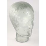 A very unusual pressed glass head of an attractive young flapper like girl with a bob hair cut