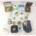 A collection of costume jewellery brooches of varying sizes and materials