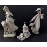 A group of LLADRO figurines to include a girl with doves (4915) standing 24cm high, no damage