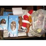 A box full of Christmas decorations including cards, present labels, tinsel and various ornaments