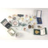 An attractive collection of costume brooches and pins of varying size and materials