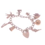 A fully hallmarked 9ct gold charm bracelet, each of 8 charms individually hallmarked, weight 27g