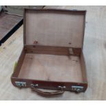 A small leather hand-sewn suitcase measuring 35x22x9cm approx