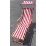 A SUMMER STEAL not to be missed! A stylish red/white striped canvas deck chair with sunshade and