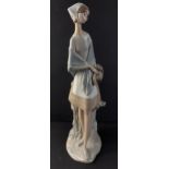 A tall LLADRO figurine of a young woman with basket stands 47cm tall approx