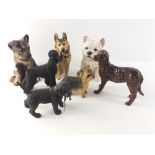 A collection of ornamental models of DOGS to include JOHN BESWICK marked Labradoodle, LENOX German