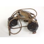 A pair of VINTAGE earphones - possibly of military origin.