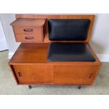A RETRO teak hall telephone or lounge seat with faux black leather seat and back pads - 3ft in