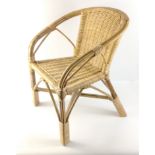 A child's wicker chair in nice condition, stands 50cm high