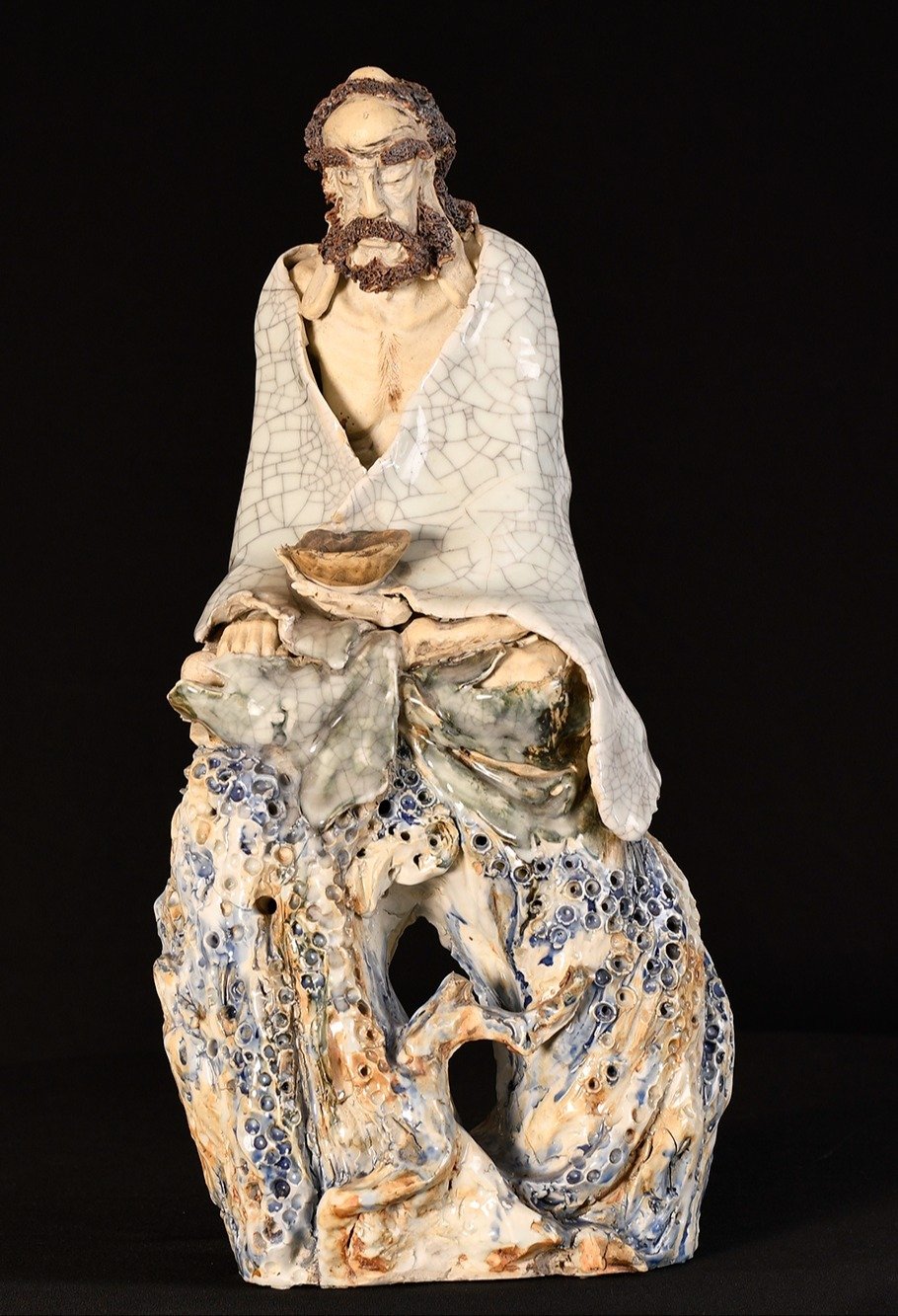 A completely hand sculpted original Shiwan porcelain figure
