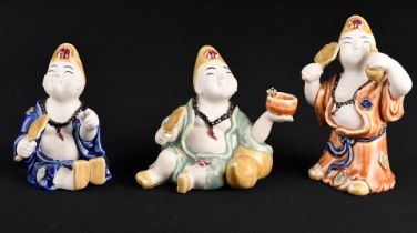 This delightful little set of 3 Chinese porcelain figures are hand painted and glazed.