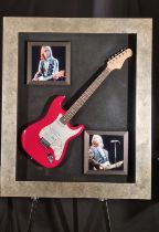 A framed guitar bearing the original signature of the famous musician TOM PETTY