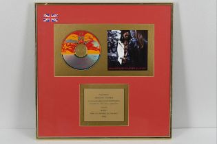 This is a LENNY KRAVITZ award from Virgin Records in recognition of 100,000 sales of his album
