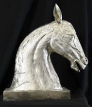 A very large cast horse head on base made from aluminium