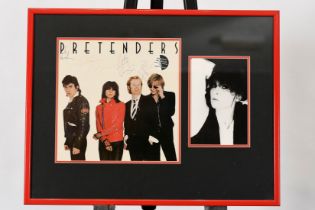 A framed memorabilia presentation of a signed album cover with CHRISSIE HYNDE and her band members