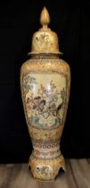 A unique large 1.9 metre porcelain temple jar with hand painted scenes