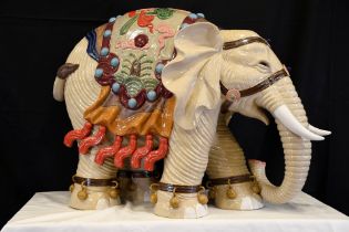 An original Shiwan porcelain elephant which has been hand painted and decorated in fine detail