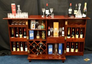 A hand made rosewood folding bar with various compartments for bottles glasses and accoutrements