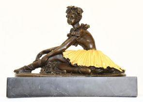 A ballet dancer in solid bronze on a black marble base.