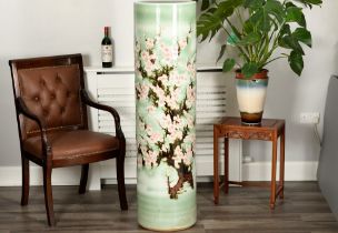 A very heavy hand made Chinese porcelain vase with embossed floral design and Chinese writing