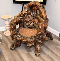 A unique piece of furniture that has been hand made from old tree roots