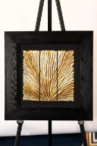 A modern framed art with a gold & silver coloured hand carved wooden panel which has been set into