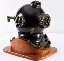A 20" high Mark V US Navy style diver's helmet in brass and metal and is attached to custom made